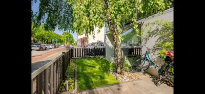 a bike parked next to a fence next to a tree at Spacious 3-Bedroom Apartment Amsterdam West - by Peter in Amsterdam
