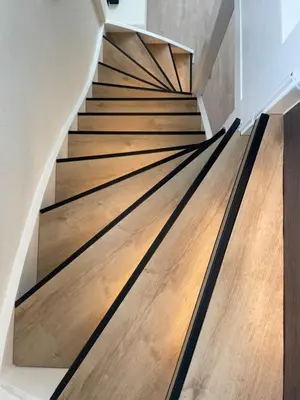 a staircase with wood treads in a house at Palm Beach House in Zandvoort