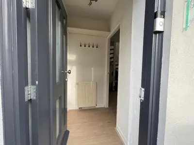 an open door to a hallway with a hallway at Palm Beach House in Zandvoort
