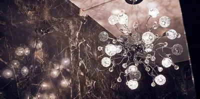 a chandelier hanging from a wall in a room at Belfort Hotel in Amsterdam