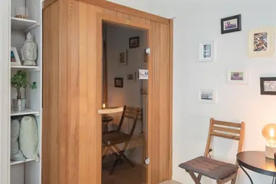 a door leading into a room with a table and chairs at Historical Tiny Home (+Private Sauna) in Zandvoort
