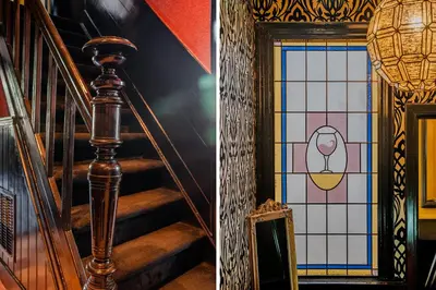 a staircase with a stained glass window and a stair case at Boutique Pension Code Rosé in Noordwijk