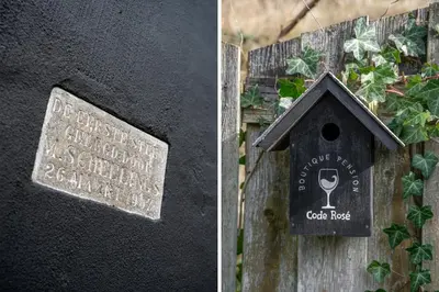 a sign on the side of a building with a bird house at Boutique Pension Code Rosé in Noordwijk