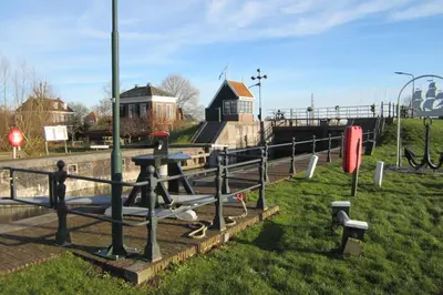 a park with a picnic table in the grass at Aan de Dijk in Edam