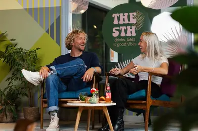 a man and a woman sitting in chairs at Stayokay Hostel Amsterdam Oost in Amsterdam