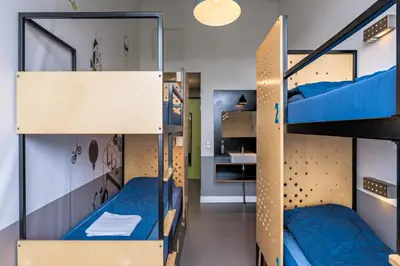 a room with bunk beds in a hostel at Stayokay Hostel Amsterdam Oost in Amsterdam