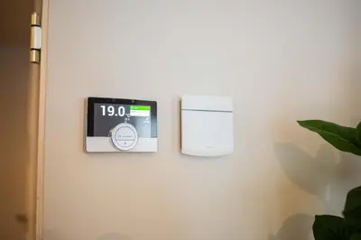 a clock on a wall with a clock on it at Alphabet Apartments - Kerkstraat 71 in Hilversum