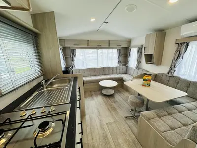 a kitchen and living room of a caravan at DD 58 - Camping de Duindoorn - AIRCO in IJmuiden