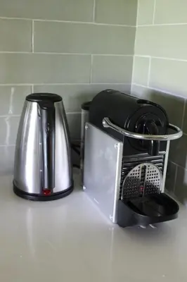 a kitchen counter with a toaster and a tea pot at Holiday home Landelijk Amsterdam in Amsterdam