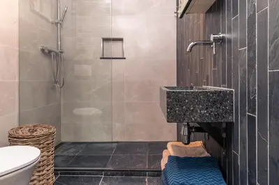 a bathroom with a shower and a sink at Holiday home Landelijk Amsterdam in Amsterdam
