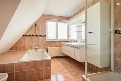 a bathroom with a sink and a shower at Villa Duin en Strand in Bergen aan Zee