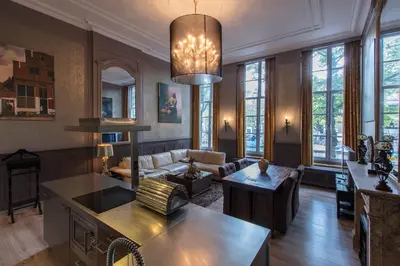 a living room with a couch and a table at Dutch Masters Short Stay Apartments in Amsterdam