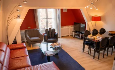 a living room with a couch and a table at Dutch Masters Short Stay Apartments in Amsterdam