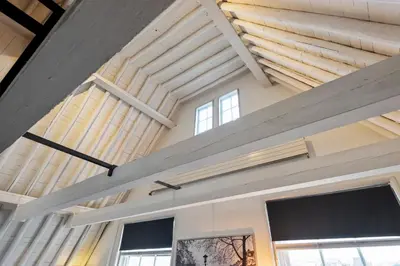 a room with wooden ceilings and windows at Spaarne Luxury Residence Haarlem in Haarlem