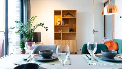 a dining room with a table with glasses on it at Huis met de krul in Amsterdam