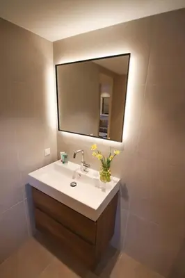 a bathroom with a sink and a mirror at Volendam Lakeside Retreat - 20 min from Amsterdam in Volendam