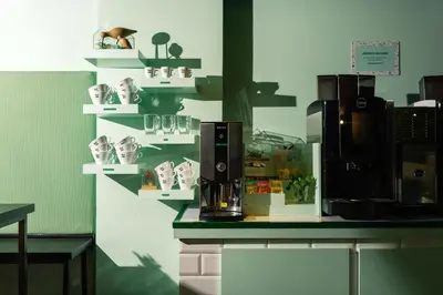 a kitchen with a counter with a coffee maker on it at Qbic Amsterdam WTC in Amsterdam