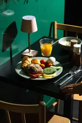 a plate of food on a table with a plate of food at Qbic Amsterdam WTC in Amsterdam