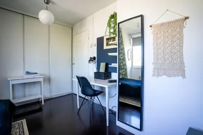 a room with a mirror and a desk and a chair at Your own floor in authentic picturesque dikehouse - dijkhuis181 in Amsterdam