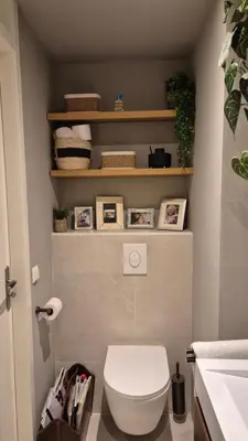 a bathroom with a white toilet in a room at Bungalow 15 op Recreatiepark De Wielen in Sint Maarten