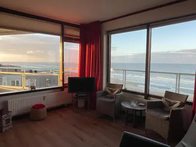 a hotel room with a view of the ocean at Sterflat 207 in Egmond aan Zee