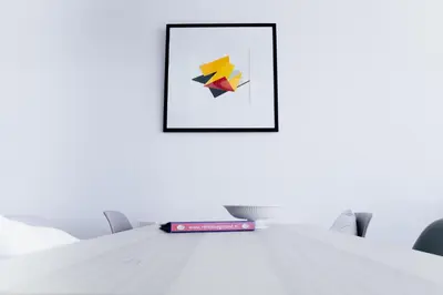 a book sitting on top of a table with a picture at Sterflat 227 in Egmond aan Zee