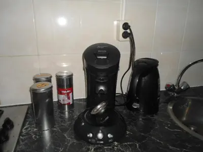 a black coffee maker on a counter next to a sink at Halte71 in Zandvoort