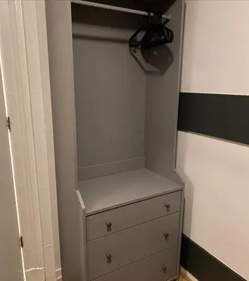 a closet with a dresser in a room at Halte71 in Zandvoort