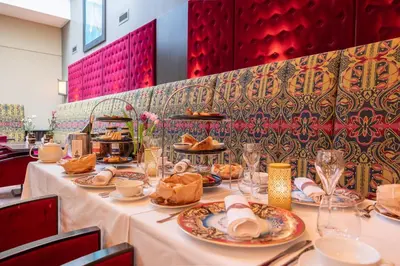 a long table with plates of food on it at Grand Hotel Amrâth Amsterdam in Amsterdam