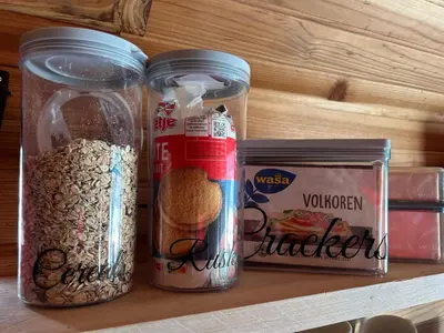 two jars filled with food sitting on a shelf at Island Sleeping in Aalsmeer