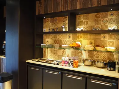 a kitchen with a counter with some food on it at Blossoms City Hotel in Amsterdam