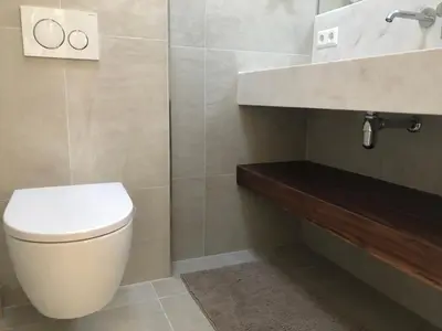 a bathroom with a toilet and a sink at Globetrotter in Bergen