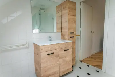 a bathroom with a sink and a mirror at Newly renovated luxurious Villa / hottub / sauna / 7 bedrooms in Zeewolde