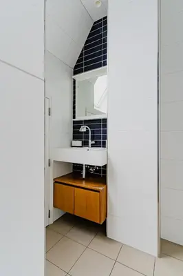 a bathroom with a sink and a mirror at Apartments De Hallen in Amsterdam