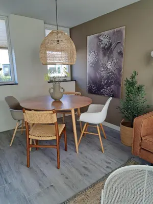 a dining room with a table and chairs at Bundi Beach in Egmond aan Zee