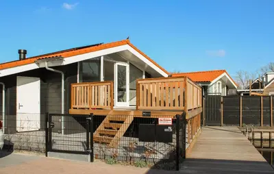 a house with two decks on top of it at Braassermerhuis in Rijnsaterwoude
