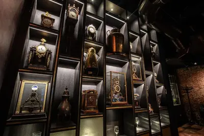 a wall filled with lots of different types of clocks at Ambassador City Centre Hotel in Haarlem