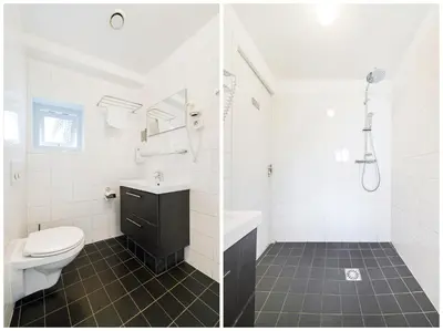 a white bathroom with a toilet and a sink at Ambassador City Centre Hotel in Haarlem