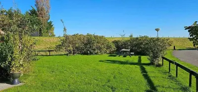 a park with a picnic table in the grass at Rekerlanden 274 in Warmenhuizen