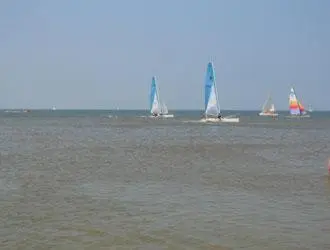 a group of sailboats in the water on the ocean at Hotel de Admiraal in Noordwijk aan Zee