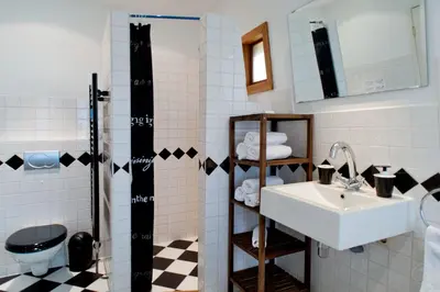 a bathroom with a sink and a toilet at Canal Holiday Apartment in Amsterdam