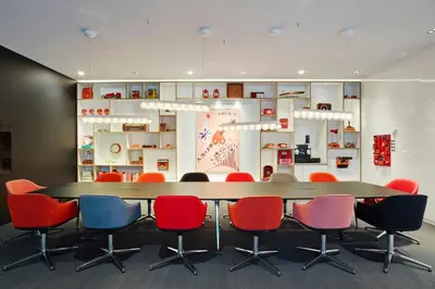 a conference room with a table and chairs at citizenM Schiphol Airport in Schiphol