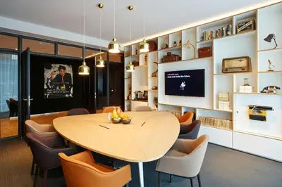 a dining room with a table and chairs at citizenM Schiphol Airport in Schiphol