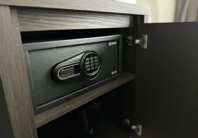 a microwave oven in a cabinet in a room at Boutique Hotel Hans - Amsterdam Schiphol Airport in Badhoevedorp