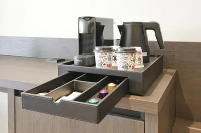 a kitchen with a trayasteryasteryasteryasteryasteryasteryasteryasteryasteryasteryastery at Boutique Hotel Hans - Amsterdam Schiphol Airport in Badhoevedorp