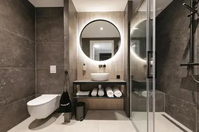 a bathroom with a sink and a mirror at Boutique Hotel Hans - Amsterdam Schiphol Airport in Badhoevedorp
