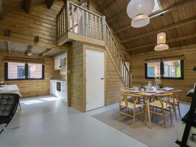 a kitchen and dining room with a table and chairs at Amaryllis in Soesterberg
