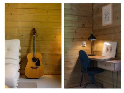a bedroom with a guitar and a desk with a chair at Amaryllis in Soesterberg