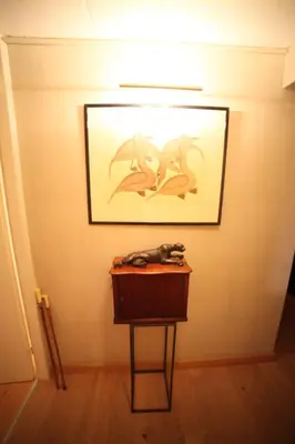 a table in a room with a picture on the wall at B&B de singel in Utrecht