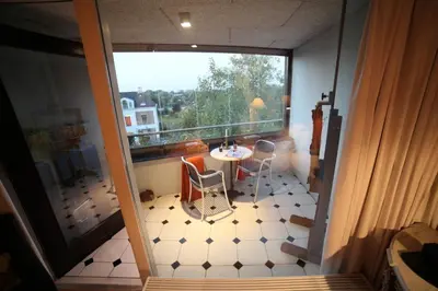 a view of a room with a table and a window at B&B de singel in Utrecht